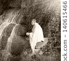 Young guy at old waterfall 140615466