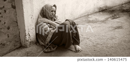 Frozen girl sitting on the floor 140615475