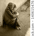 Frozen girl sitting on the floor 140615476