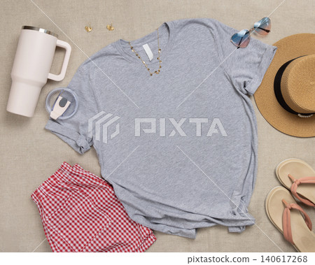 Blank heather grey shirt mockup with woman summer accessories, copy space on front Blank heather grey shirt mockup with woman summer accessories, copy space on front 140617268