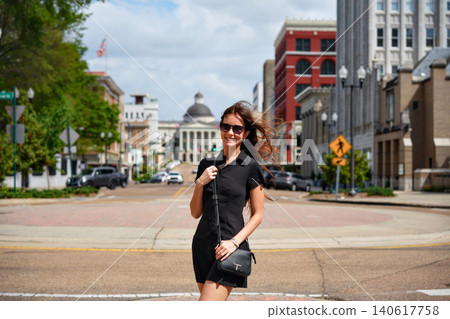 Woman in Black Dress Strolling on Capitol Street in Jackson Mississippi 140617758