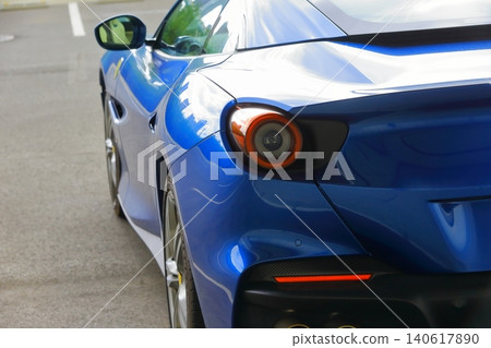 A blue Italian sports car A blue Italian sports car 140617890