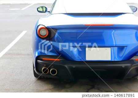 A blue Italian sports car A blue Italian sports car 140617891
