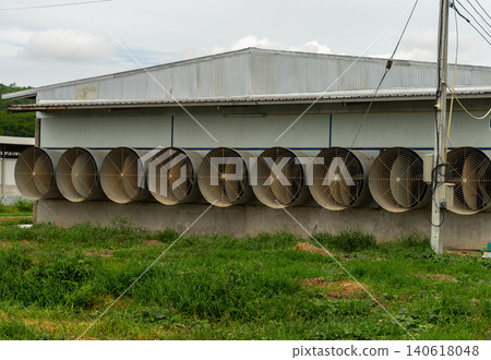 Industrial Ventilation Fans on Modern Poultry Farm Building Exterior 140618048