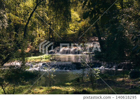 Monasterio de Piedra: Sunny Day, Small Waterfalls, Wooden Bridge, Verdant Surroundings 140618295