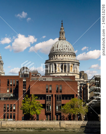 St Paul's Cathedral Dome Rising Above Thames Riverside Buildings With Blue Sky In Central London St Paul's Cathedral Dome Rising Above Thames Riverside Buildings With Blue Sky In Central London 140618298