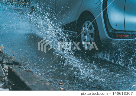Cars splashing water Cars splashing water 140618307