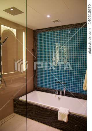 Al Marjan Island, United Arab Emirates, November 11 2017: Bathroom with walk in shower and bathtub in luxury hotel 140618670