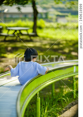 A girl riding a roller coaster A girl riding a roller coaster 140618999