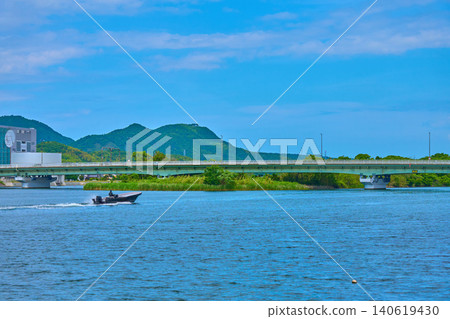 A view of the Kunibiki Bridge area (including Mt. Takayama and Mt. Wakurayama) from Otesenba-cho, Matsue City, Shimane Prefecture in spring. A view of the Kunibiki Bridge area (including Mt. Takayama and Mt. Wakurayama) from Otesenba-cho, Matsue City, Shimane Prefecture in spring. 140619430