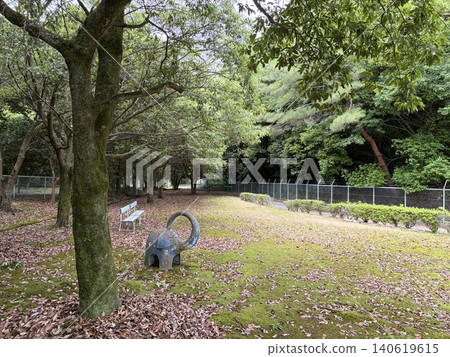 Elephant-shaped playground equipment in a lush green park 1 Elephant-shaped playground equipment in a lush green park 1 140619615
