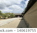 Temple gate and earthen wall 140619755