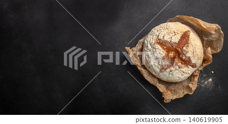 Artisan sourdough bread on dark background with copy space, rustic homemade bakery concept 140619905