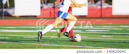 Players Chase the Soccer Ball During a Game on the Field 140620045