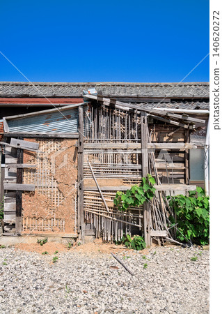 Dilapidated wooden vacant house, mud walls Dilapidated wooden vacant house, mud walls 140620272