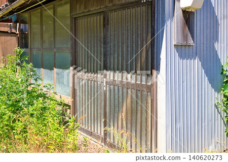 Sliding entrance door of an old vacant house from the Showa era Sliding entrance door of an old vacant house from the Showa era 140620273