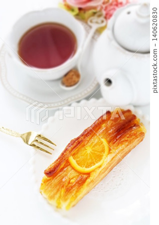 Orange Danish pastry and tea Orange Danish pastry and tea 140620830
