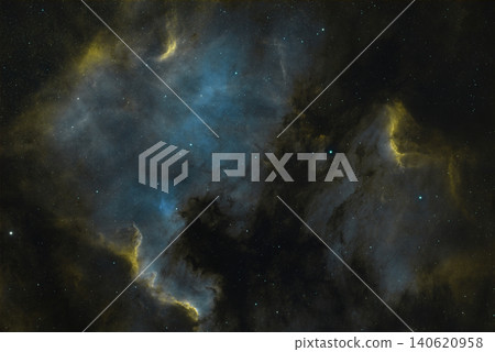 Vast celestial clouds of glowing blue and yellow gas and dark dust drift through space. Vast celestial clouds of glowing blue and yellow gas and dark dust drift through space. 140620958