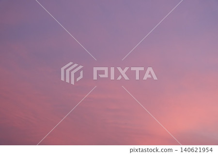 The soft, gentle colors of the sunset spread across the sky. The soft, gentle colors of the sunset spread across the sky. 140621954
