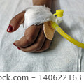 Close up shot of child hand receiving intravenous therapy in hospital. Close up shot of child hand receiving intravenous therapy in hospital. 140622163