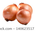 Three fresh whole brown onions with golden papery skin isolated. High quality studio shot of raw organic yellow onions used for cooking and healthy food recipes. 140623517