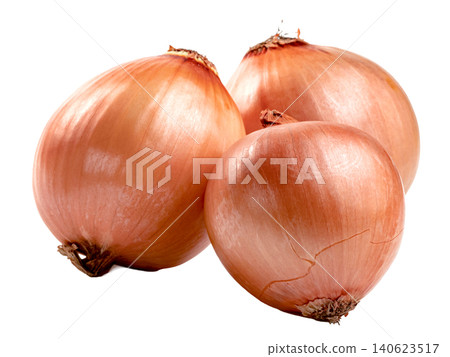 Three fresh whole brown onions with golden papery skin isolated. High quality studio shot of raw organic yellow onions used for cooking and healthy food recipes. Three fresh whole brown onions with golden papery skin isolated. High quality studio shot of raw organic yellow onions used for cooking and healthy food recipes. 140623517