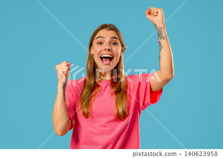 Blonde Young Woman Makes Victory Gesture Yes, Clenched Fist,Joy Triumphant Lady Blonde Young Woman Makes Victory Gesture Yes, Clenched Fist,Joy Triumphant Lady 140623958