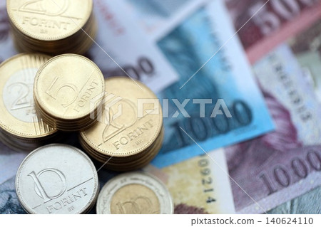 Stack of Hungarian Forint currency money bills and coins. HUF currency banknotes and coins Stack of Hungarian Forint currency money bills and coins. HUF currency banknotes and coins 140624110