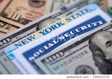 Social security number and New York driving license with US dollar money bills Social security number and New York driving license with US dollar money bills 140624176