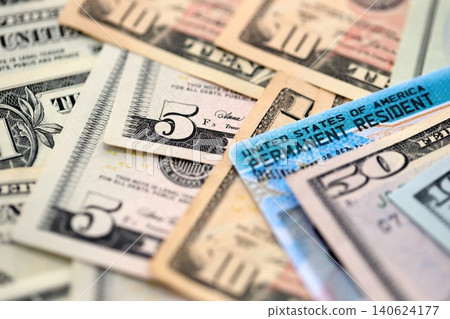 American US dollars money bills with permanent resident green card diversity visa American US dollars money bills with permanent resident green card diversity visa 140624177