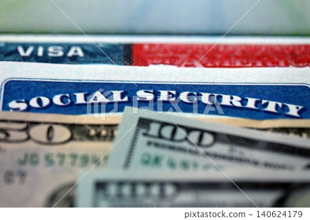 Social security number and visa on passport page with US dollar money bills Social security number and visa on passport page with US dollar money bills 140624179