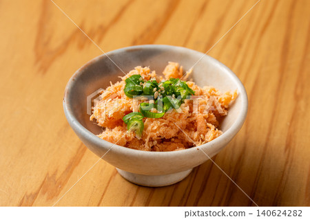 A luxurious Japanese-style snack featuring flavorful salmon and spicy mentaiko (spicy cod roe). A luxurious Japanese-style snack featuring flavorful salmon and spicy mentaiko (spicy cod roe). 140624282