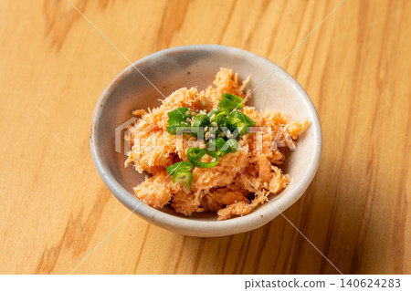 A luxurious Japanese-style snack featuring flavorful salmon and spicy mentaiko (spicy cod roe). A luxurious Japanese-style snack featuring flavorful salmon and spicy mentaiko (spicy cod roe). 140624283