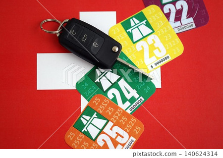 Switzerland vignette stickers with ignition key on Swiss flag close up. Driving permit 140624314