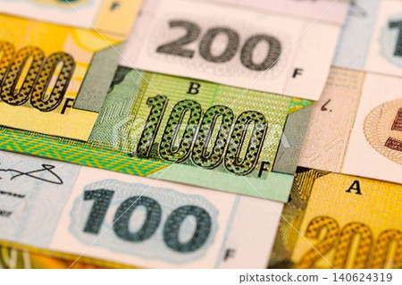 Congolese franc money bills in big amount on table close up. Rich life concept in Congo Congolese franc money bills in big amount on table close up. Rich life concept in Congo 140624319