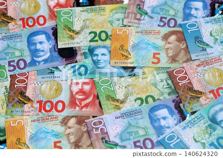 New Zealand dollar money bills in big amount on table close up. Rich life concept in New Zealand New Zealand dollar money bills in big amount on table close up. Rich life concept in New Zealand 140624320
