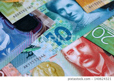 New Zealand dollar money bills in big amount on table close up. Rich life concept in New Zealand New Zealand dollar money bills in big amount on table close up. Rich life concept in New Zealand 140624321