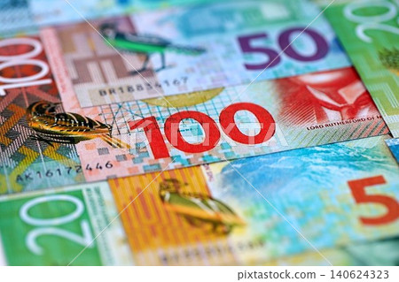 New Zealand dollar money bills in big amount on table close up. Rich life concept in New Zealand 140624323