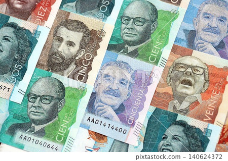 Colombian pesos money bills banknotes lies in big pile on table close up. Finances and business Colombian pesos money bills banknotes lies in big pile on table close up. Finances and business 140624372