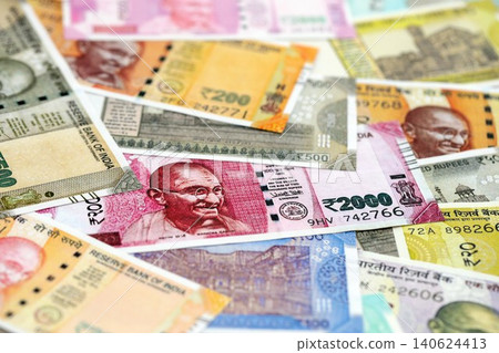 Big pile of Indian Rupees money bills banknotes close up. Lots of money of Indian INR currency cash Big pile of Indian Rupees money bills banknotes close up. Lots of money of Indian INR currency cash 140624413