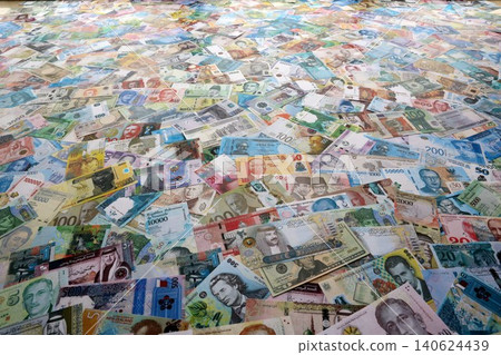 Different banknotes from many various currencies of the whole world. Big bunch of money bills Different banknotes from many various currencies of the whole world. Big bunch of money bills 140624439