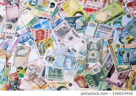 Different colorful banknotes from many various currencies of the world. Big stack of money bills Different colorful banknotes from many various currencies of the world. Big stack of money bills 140624440