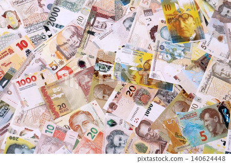 Various currencies money bills banknotes in yellow and orange color. Many cash bills Various currencies money bills banknotes in yellow and orange color. Many cash bills 140624448
