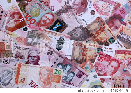 Various currencies money bills banknotes in red color. Many cash bills 140624449
