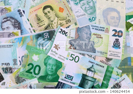Various currencies money bills banknotes in green color. Many cash bills 140624454