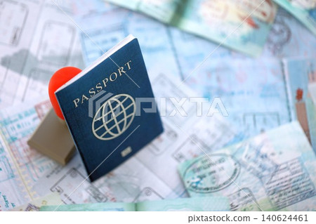 Border crossing stamp on passport pages full of colorful stamps after travel and tourism Border crossing stamp on passport pages full of colorful stamps after travel and tourism 140624461