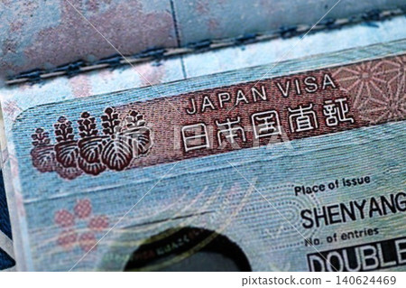Detail of Japan visa applied on passport. Japanese visa header in passport page Detail of Japan visa applied on passport. Japanese visa header in passport page 140624469