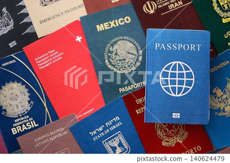 Fictional passport book travel document on big amount of real passport covers Fictional passport book travel document on big amount of real passport covers 140624479