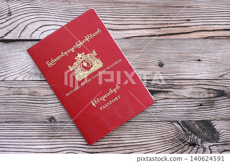 Myanmar passport on table close up. Official identification document book for citizens of Myanmar 140624591
