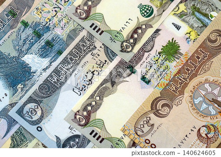 Iraqi dinar paper banknotes pile on table. Iraq IQD currency money bills in big amount 140624605